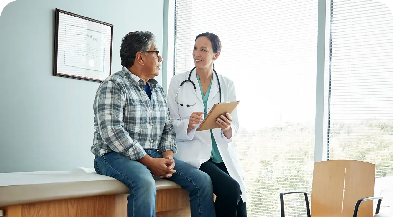 Healthcare provider reviewing care information with a patient during an office visit.