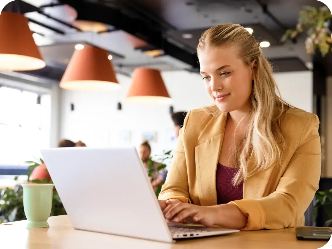 Professional reviewing stop-loss options on her laptop.